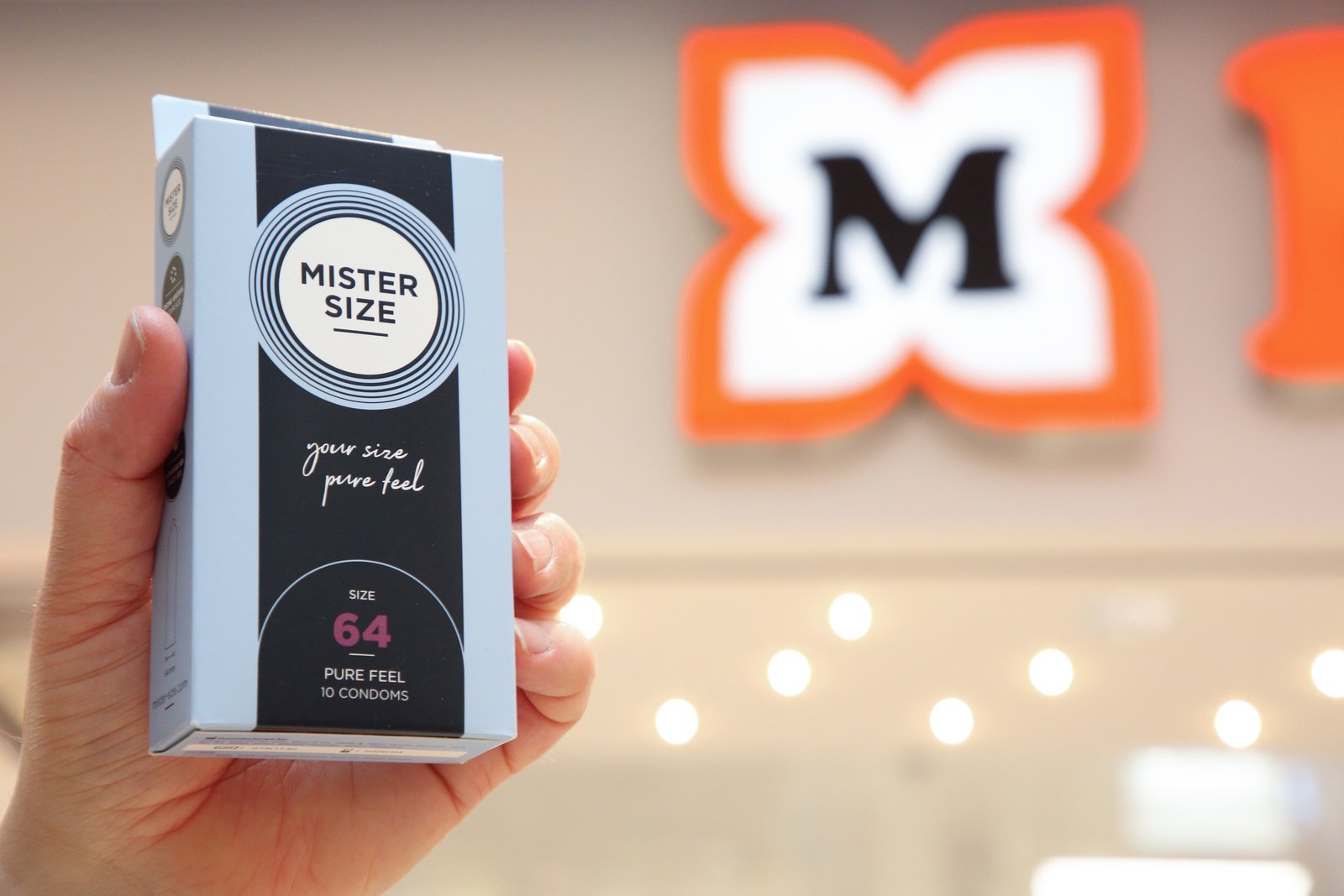Mister Size Kondompackung und Müller Logo